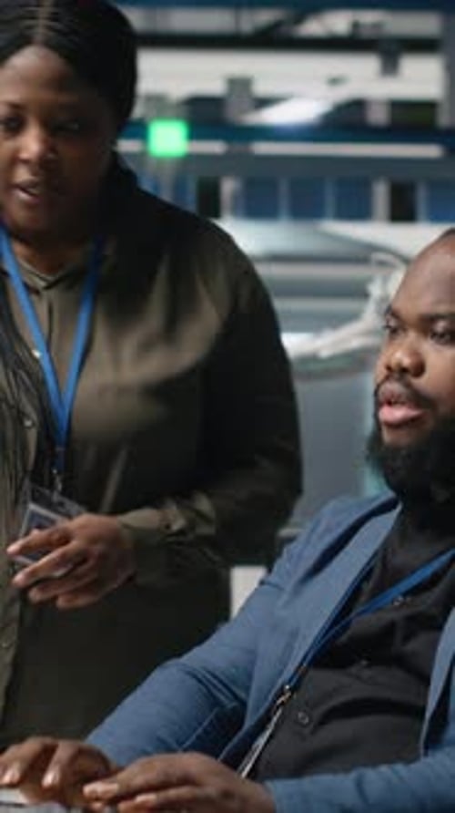 Two Adults Collaborating in a Modern Office Setting