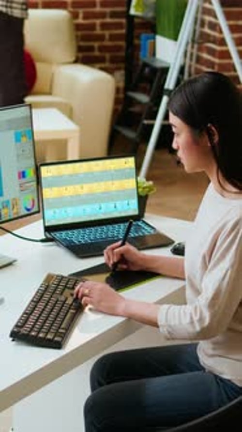Vertical Video Freelance Designer Works on a Photo Editing Project in a Remote Office