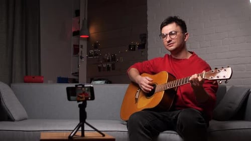 Man Plays Guitar and Records Himself