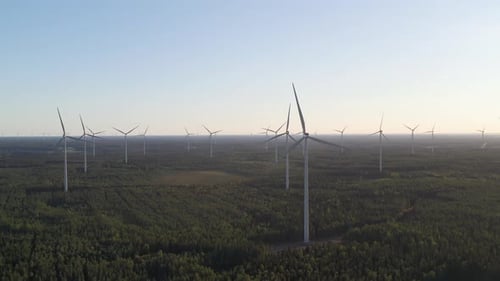 Panoramic landscape of wind farm with wind turbines generating renewable energy, drone shot
