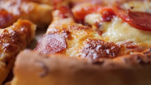 Macro shot across a hot pizza pie from crust to crust.