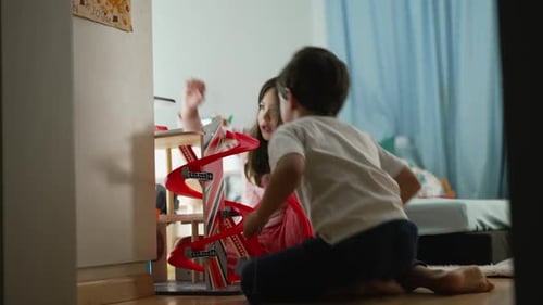 Children Play Together With Toy Car Race Track