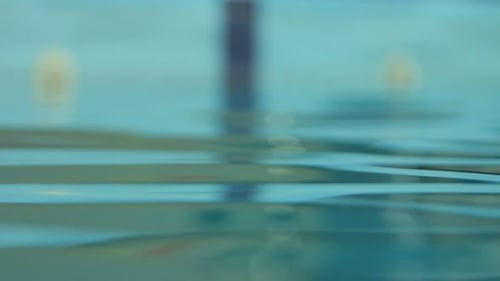 Water Background. Closeup of Water Surface in Swimming Pool. Close Up Of