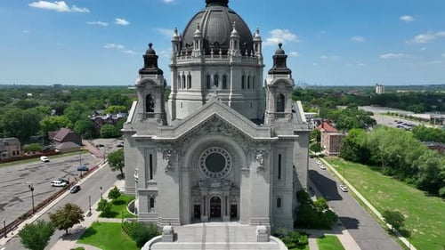 Ornate cathedral in Saint Paul, Minnesota on summer day. Aerial rising shot of Cathedral of Saint Pa