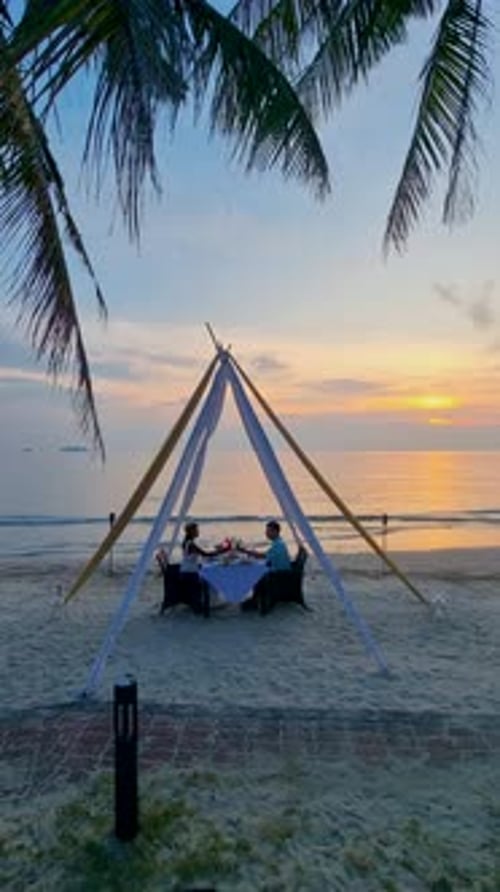 Romantic Dinner on the Beach During Sunset in Thailand at Vacation on the Island of Koh Chang