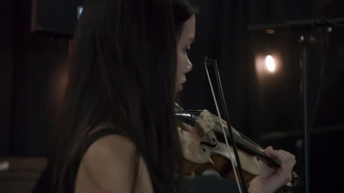Woman Plays Violin in Close Up View