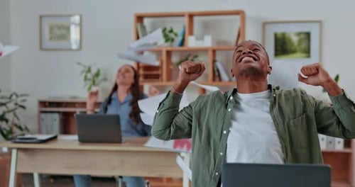Creative business people, celebration and throwing papers in air for winning