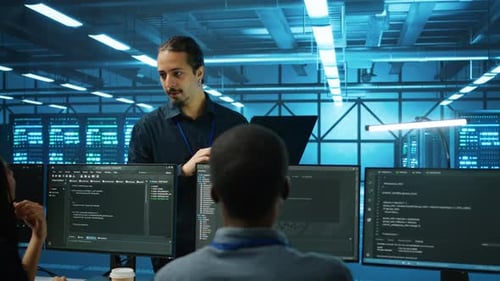 Manager Supervising Multiethnic Team Working in Data Center