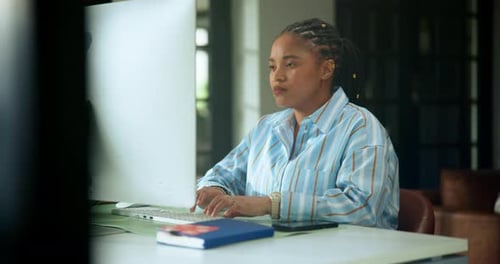 Woman Works at Computer in Modern Home Office