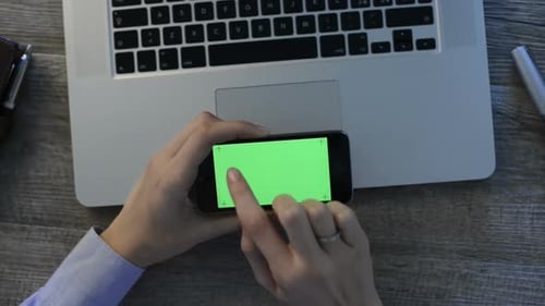 Closeup Shot Of A Businesswoman Typing A Text On Smart Phone With Green Screen. Woman Surfing The...