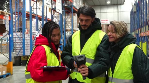 Warehouse Workers Scanning Barcodes in a Cold Storage Facility