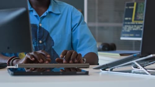 Young Black Male Programmer Typing On Computer