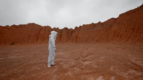 The Astronaut Goes to Explore the Surface of Mars in a Special Suit