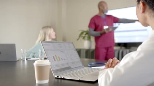 Medical Team Presents Data in Bright Office