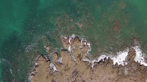 Aerial View of Tropical Coastline with Rocky Shore
