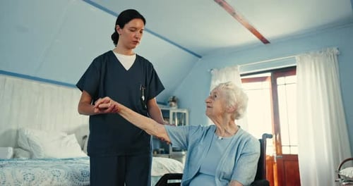 Caregiver Assists Senior Woman in Blue Room