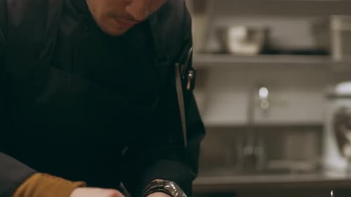 Chef Prepares Salad Greens in Restaurant Kitchen