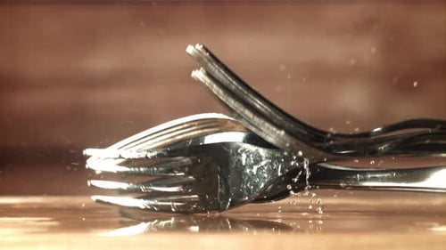 Forks Fall on a Wooden Table Filmed on a Highspeed Camera at 1000 Fps