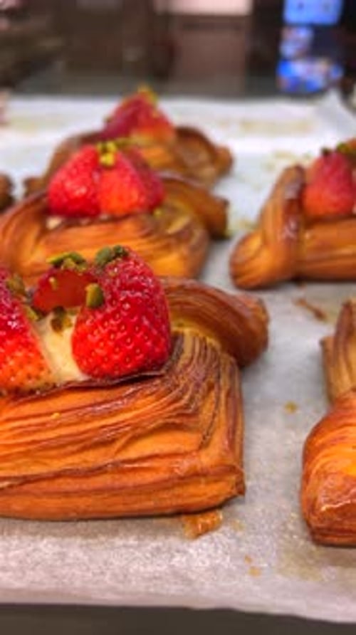 Freshly Baked Strawberry Pastries Displayed at Bakery Counter Gourmet