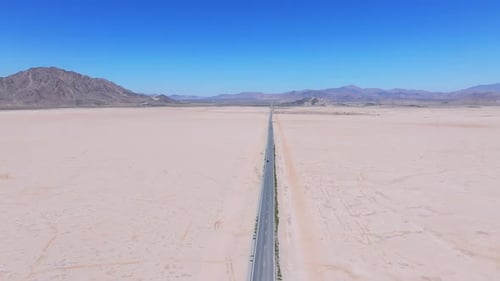 Endless Road to Horizon Through the Desert Valley Aerial View of a Desert