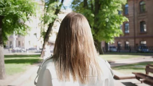 Rear View Girl Head Walking in the Park