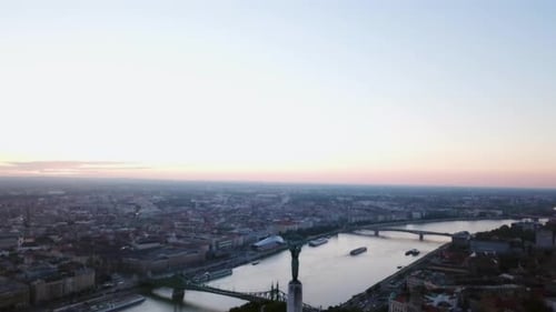 Budapest liberty statue and view of the early sun over the city