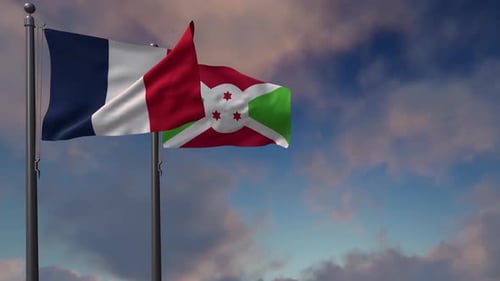 Flags of France and Burundi Waving in the Sky