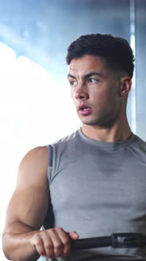Rowing machine, fitness and training with man in gym for workout, cardio challenge and bodybuilder