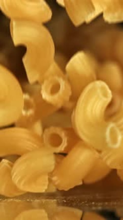 Super Slow Motion Dry Macaroni Pasta Filmed on a Highspeed Camera at 1000 Fps