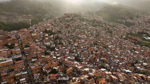 Aerial view overlooking a hillside of poor dwellings in Comuna 13, Colombia