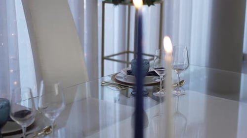 Intimate Table Setting with Candles and Fine China