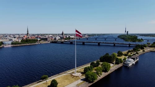 Latvian Flag - Riga Cityscape and Daugava River Aerial View, Summer, Drone, 4K
