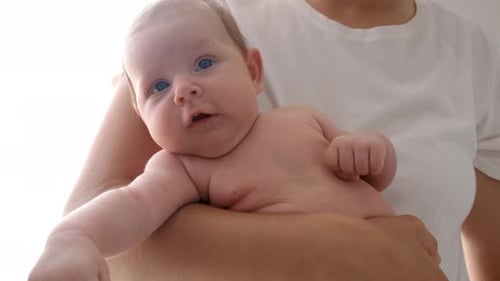 Loving Mother Holding Newborn Infant Baby