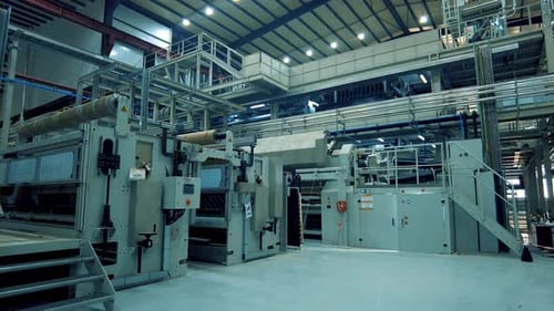 aerial shot of a production factory hangar made of metal frame
