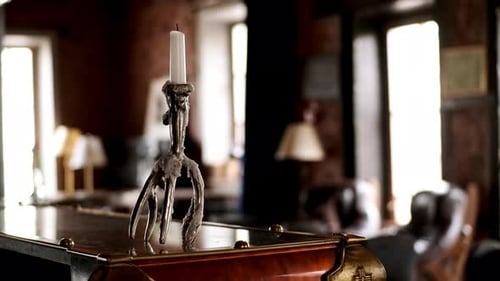 Unlit Candle Stand in Retro Candlestick on Table in Old Interior