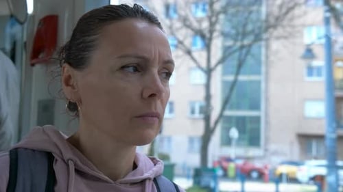 Thoughtful Female Through Tram Window