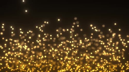 Gelbe aufsteigende Partikel mit Bokeh-Effekt