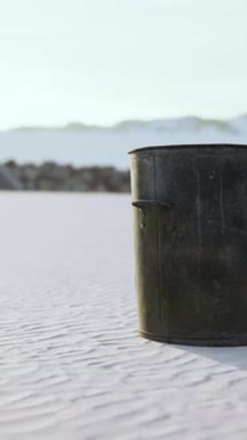 Gray Metal Garbage Bin or Trash Can on the Beach