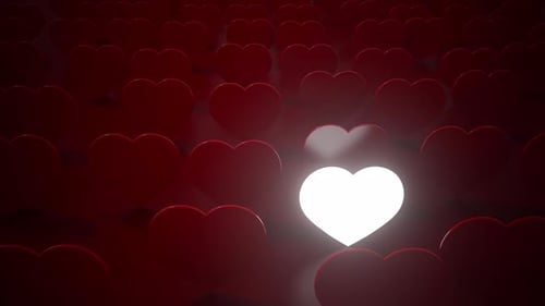 Love concept One glowing heart in a row of red hearts