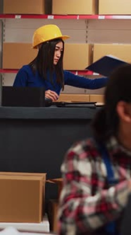 Vertical Video Two Employees Checking Goods for Distribution