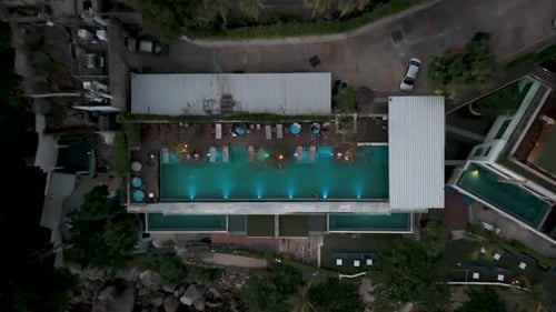 Drone aerial view of rooftop pool of a hotel in Phuket, Thailand.