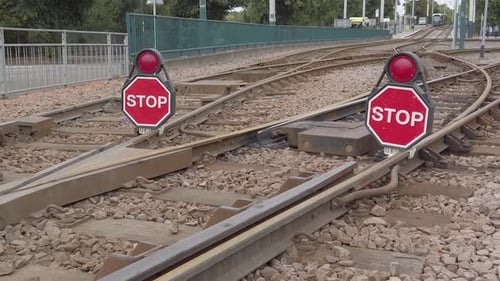 Red stop marker boards on the Nottingham tramlines warning tram drivers to go past while maintenance