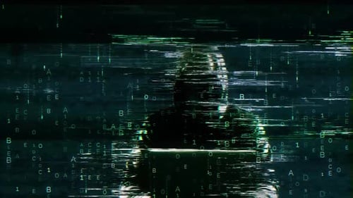 Hooded Hacker Typing on Laptop with Glitch Digital Code Background