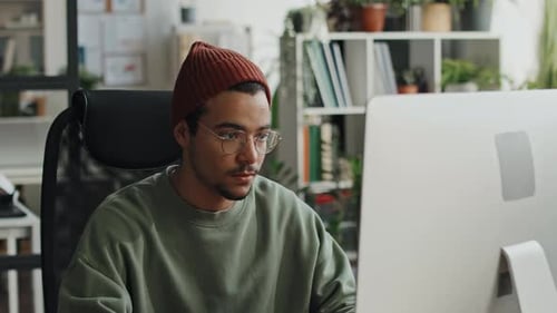 Young Developer Working on Computer