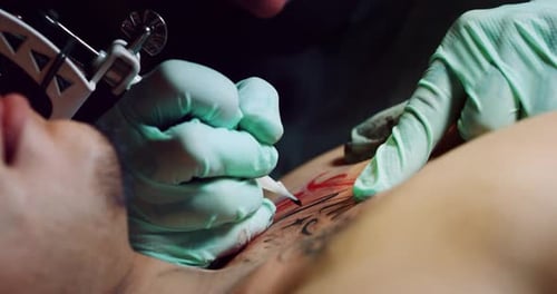 Milan/Italy-01.02.2019:Slow motion of professional master of the art of tattooing doing a tattoo t