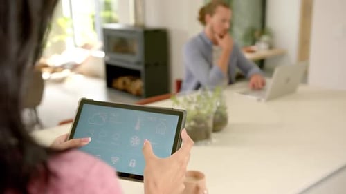 Woman Controlling Smart Home with Tablet