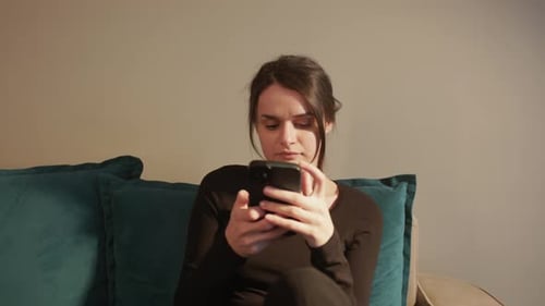 Girl Browsing Internet On Mobile Phone - Close Up Shot