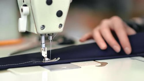 Female Dressmaker Hands Sews Textile Details Electric Sewing Machine Dressmaking Manufacture Closeup