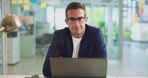 Laptop, happy and face of businessman in office with confidence for startup magazine agency