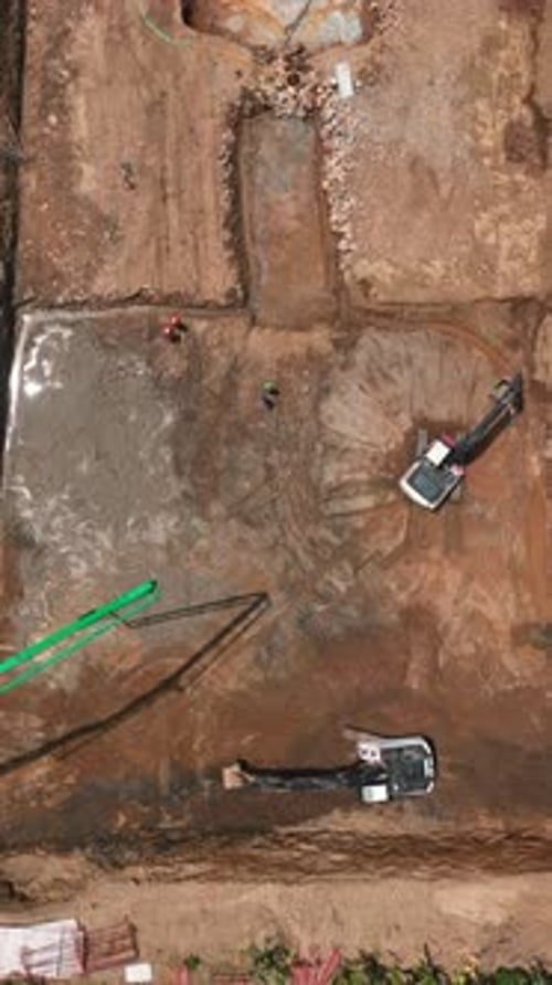 Vertical Video Workers Use Heavy Machinery to Build MultiStory Buildings